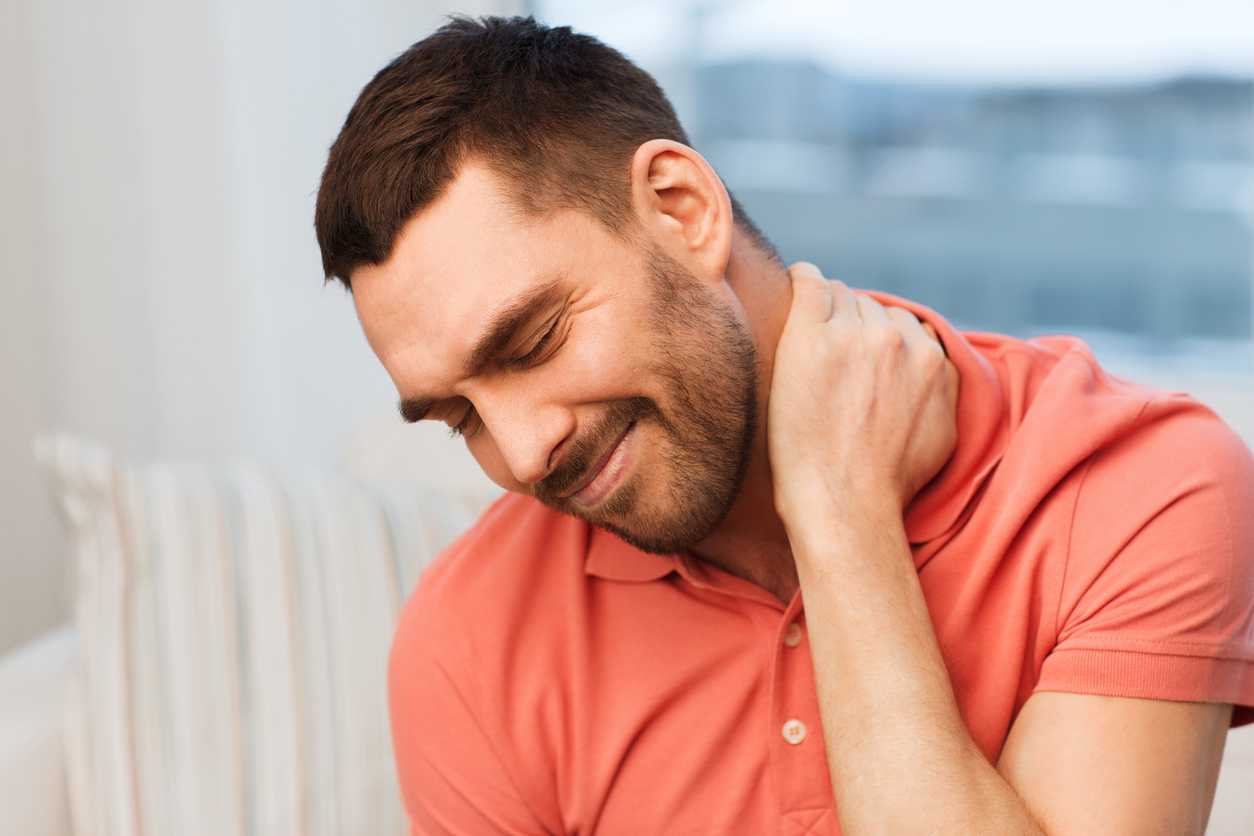unhappy man suffering from wry neck